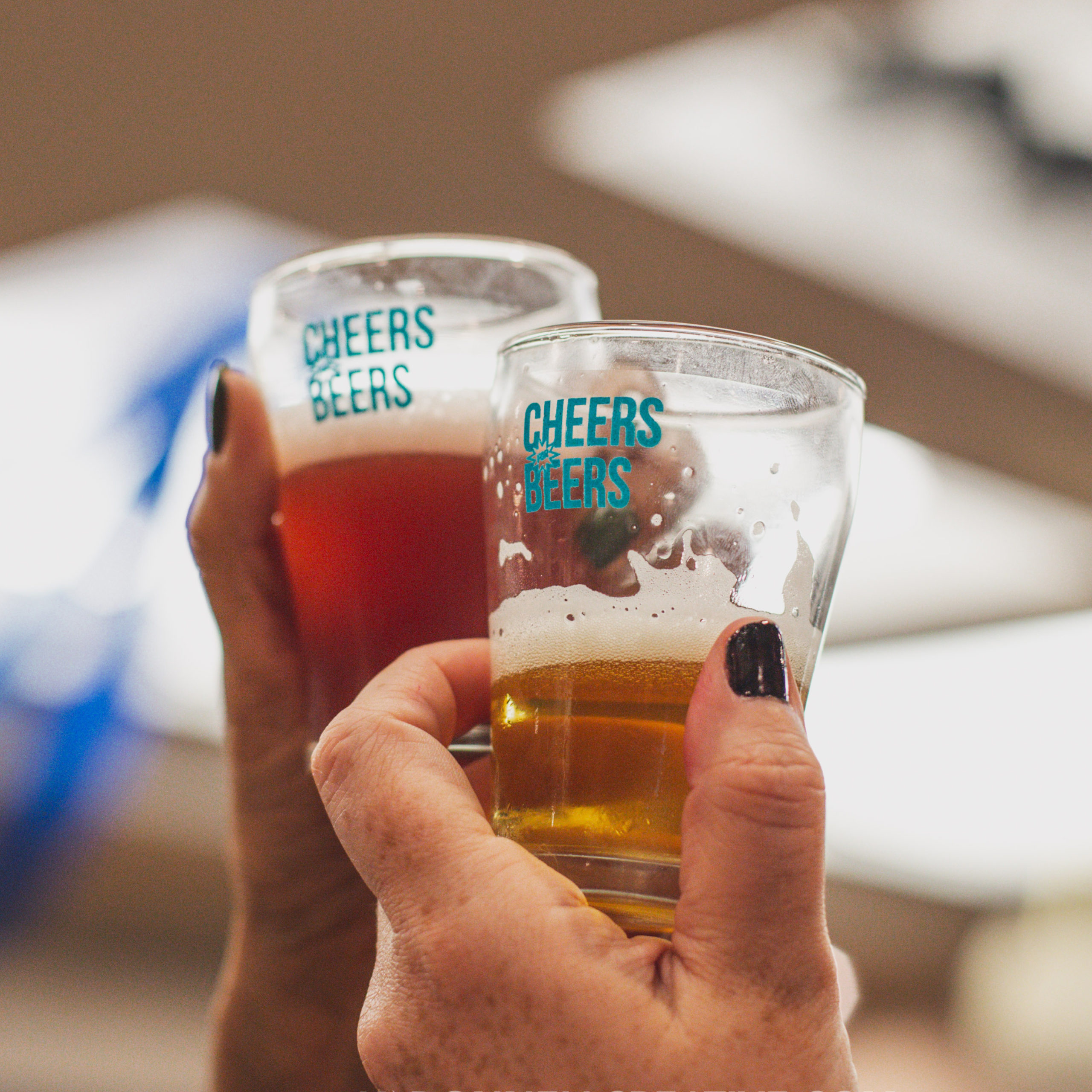 Cheers for Beers sampling glasses raised in a toast