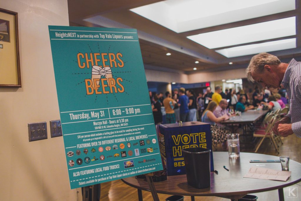 A large sign on an easel reads Cheers for Beers, welcoming patrons to the event.