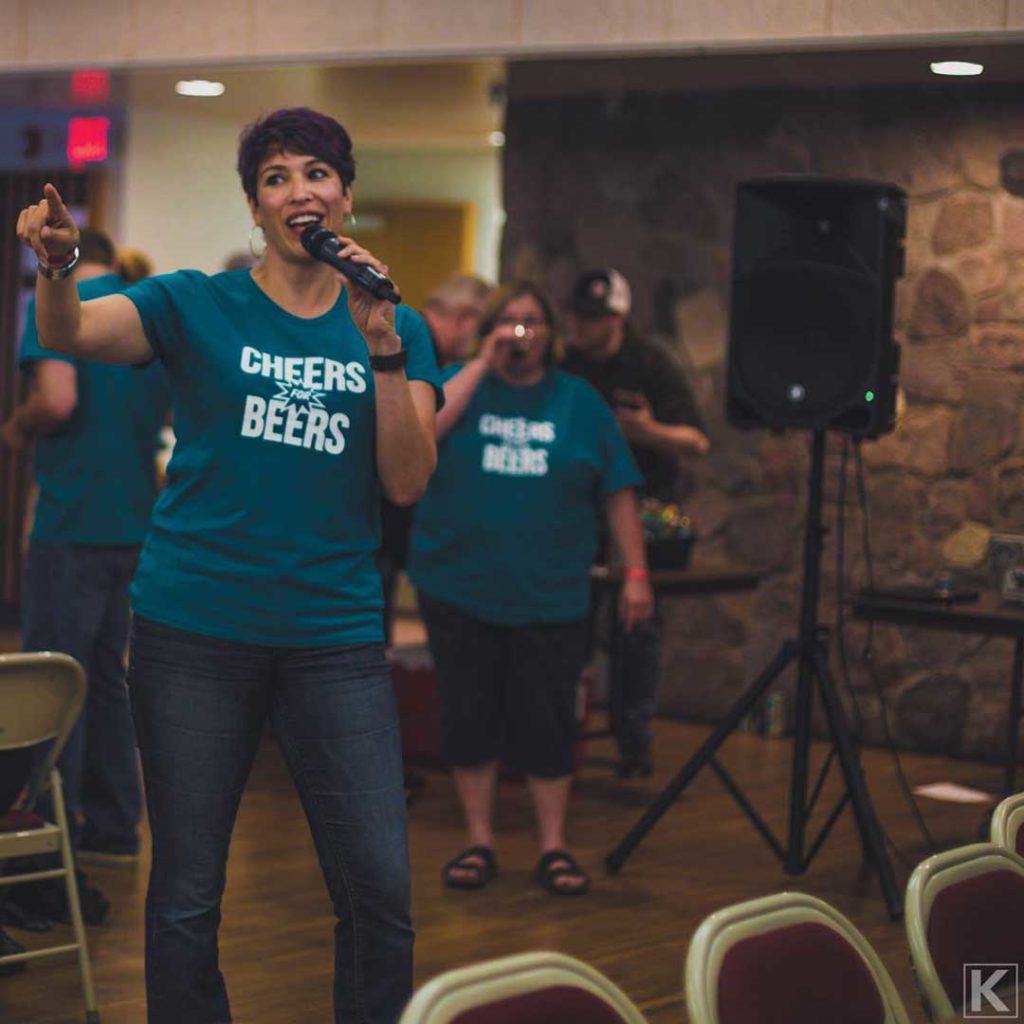An MC announces the best beer voted by people at a beer tasting event.